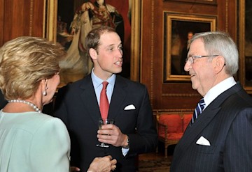 Prince William chatting to a smiling Constantine during a royal engagement. 