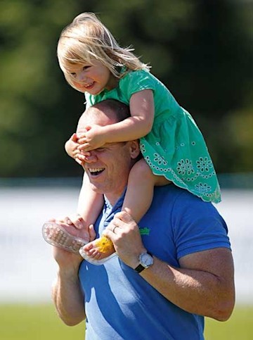 Mia Tindall covers dad's Mike's eyes during a piggyback