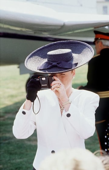 Sophie Wessex in a smart hat taking a photo 