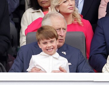 prince louis pictured sitting on lap of grandfather king charles during queen's platinum jubilee concert