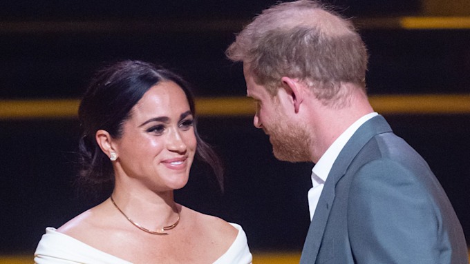 meghan markle smiling at prince harry