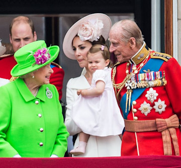 the queen smiles at little princess charlotte on balcony of buckingham palace