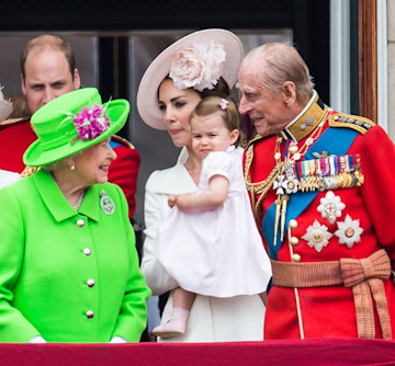 the queen smiles at little princess charlotte on balcony of buckingham palace