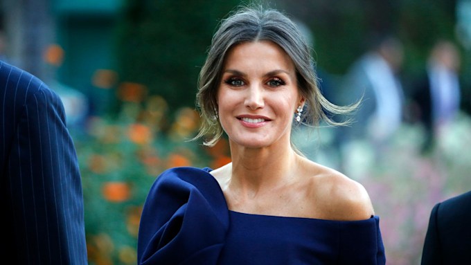 queen letizia smiles as she arrives for formal event in an off the shoulder blue evening gown