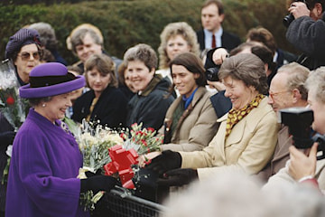 queen elizabeth visiting snettisham in norfolk after floods of 1953 wearing purple suit
