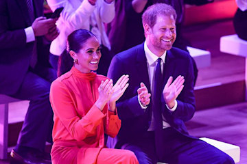 Prince Harry and Meghan Markle were seen clapping as they attended an event in Manchester