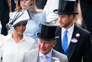 prince harry and meghan markle walk behind king charles 