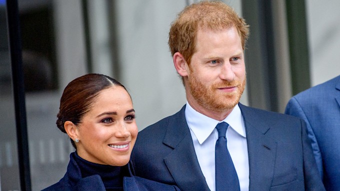 prince harry and meghan markle side by side smiling