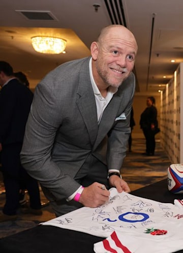Mike Tindall signing a rugby shirt at the Legends of Rugby Awards.