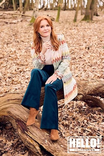 Sarah Ferguson sits on a tree trunk thinking in HELLO! shoot