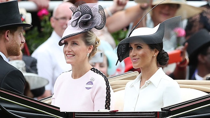 sophie wessex and meghan markle sit side by side in open carriage at ascot