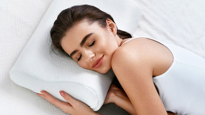 woman lying on orthopaedic pillow