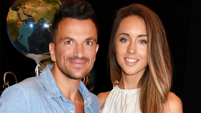 Peter Andre and wife Emily smiling in a close-up photo.